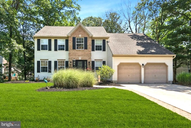 104 Sienna Ln, Glassboro, NJ 08028 - colonial-style house with a garage, a front yard, concrete driveway, and a shingled roof