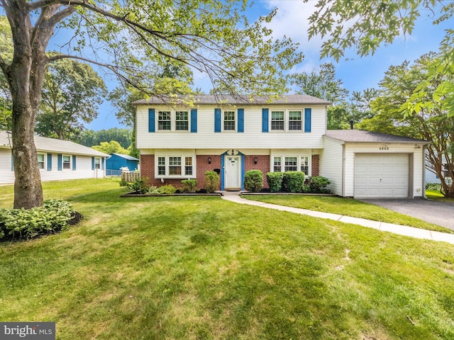 4503 Oakview Ln, Bowie, MD 20715 - colonial-style house featuring an attached garage, driveway, brick siding, and a front lawn