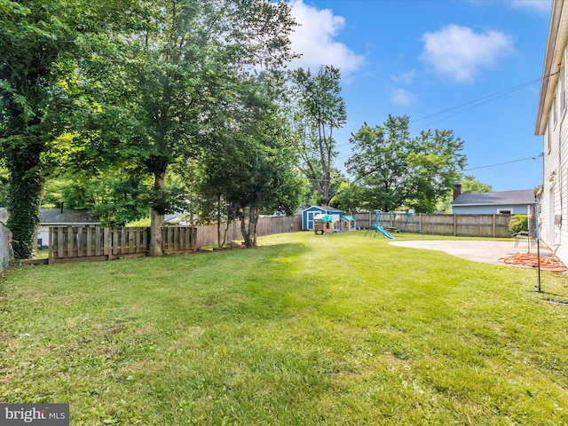 4503 Oakview Ln, Bowie, MD 20715 - fenced backyard featuring a playground, a storage shed, and a patio