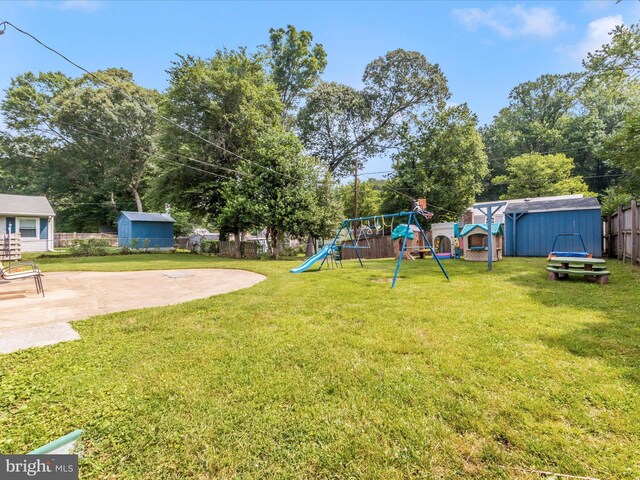 4503 Oakview Ln, Bowie, MD 20715 - fenced backyard with a storage shed, a playground, and a patio