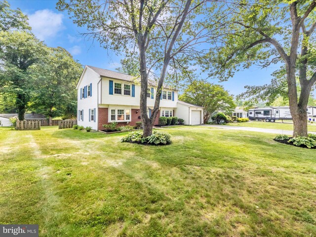 4503 Oakview Ln, Bowie, MD 20715 - colonial home featuring brick siding, an attached garage, and driveway