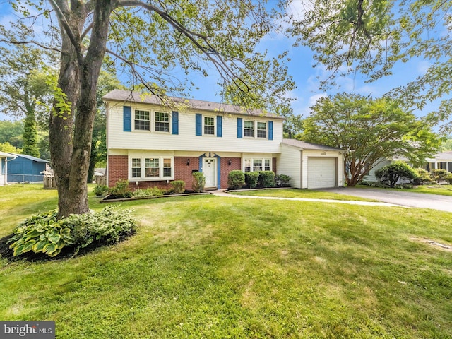 4503 Oakview Ln, Bowie, MD 20715 - colonial home featuring driveway, a garage, and brick siding