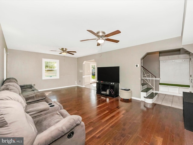 4503 Oakview Ln, Bowie, MD 20715 - living area with arched walkways, ceiling fan, wood finished floors, and stairway