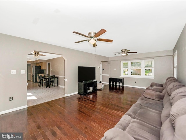 4503 Oakview Ln, Bowie, MD 20715 - living area with ceiling fan, arched walkways, and wood finished floors