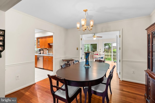 14519 Keeneland Cir, North Potomac, MD 20878 - dining area featuring a chandelier, ceiling fan, light wood finished floors, and ornamental molding