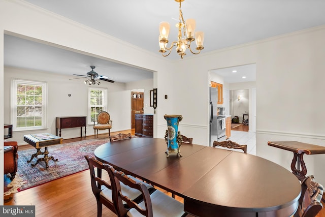 14519 Keeneland Cir, North Potomac, MD 20878 - dining area with a chandelier, crown molding, light wood-type flooring, ceiling fan, and recessed lighting