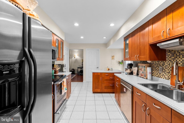 14519 Keeneland Cir, North Potomac, MD 20878 - kitchen with appliances with stainless steel finishes, light tile patterned floors, light countertops, brown cabinetry, and recessed lighting