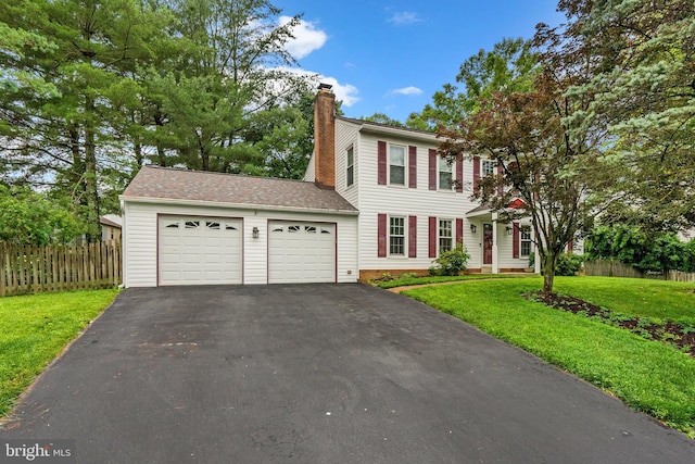 14519 Keeneland Cir, North Potomac, MD 20878 - colonial home featuring driveway, a chimney, and an attached garage