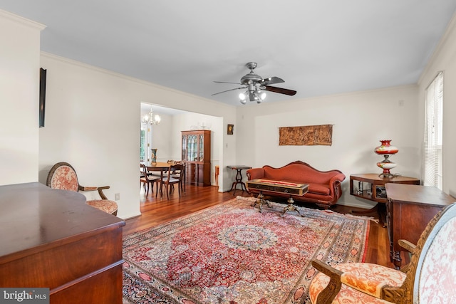 14519 Keeneland Cir, North Potomac, MD 20878 - living area with wood finished floors, a chandelier, a ceiling fan, and ornamental molding