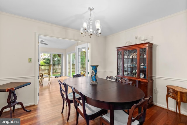 14519 Keeneland Cir, North Potomac, MD 20878 - dining room featuring wood finished floors, a chandelier, and crown molding