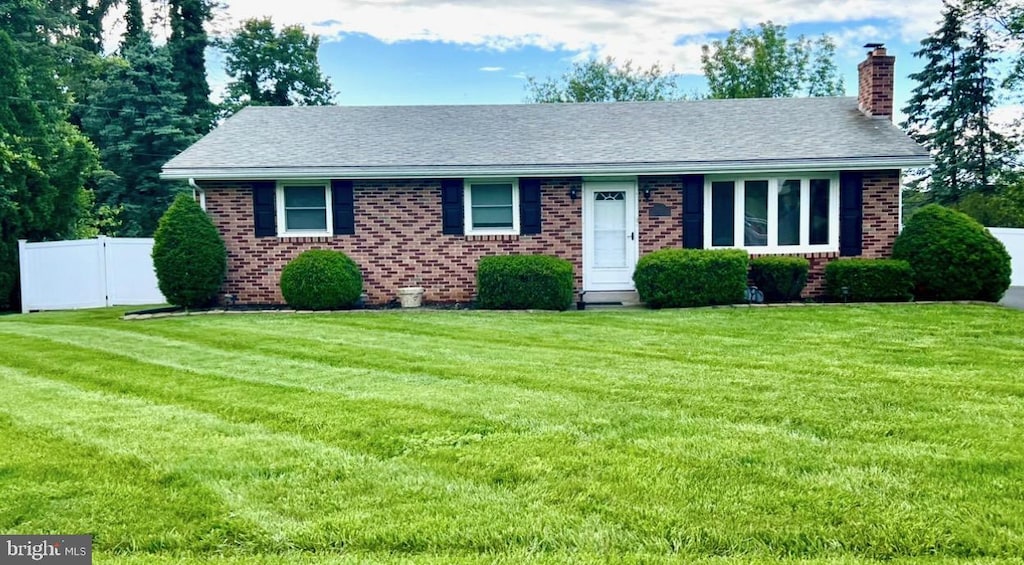 490 Snyder Rd, Reading, PA 19605 - view of front facade featuring a chimney, brick siding, and a shingled roof