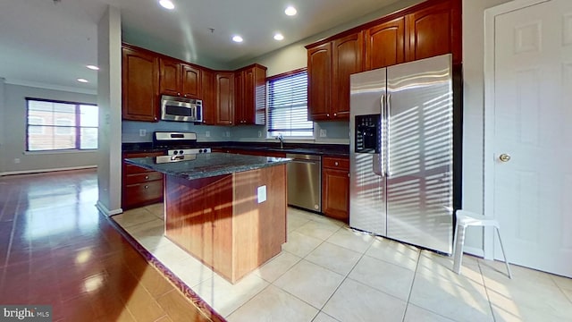 3515 Foundry Mews, Baltimore, MD 21211 - kitchen with appliances with stainless steel finishes, a center island, recessed lighting, light tile patterned floors, and dark brown cabinets