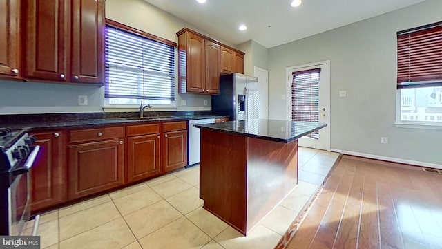 3515 Foundry Mews, Baltimore, MD 21211 - kitchen with appliances with stainless steel finishes, a center island, dark stone countertops, recessed lighting, and light tile patterned floors