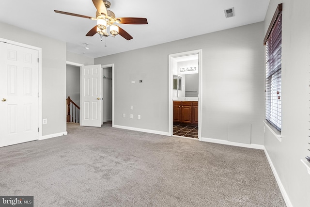 3515 Foundry Mews, Baltimore, MD 21211 - unfurnished bedroom with dark carpet, ensuite bath, and ceiling fan
