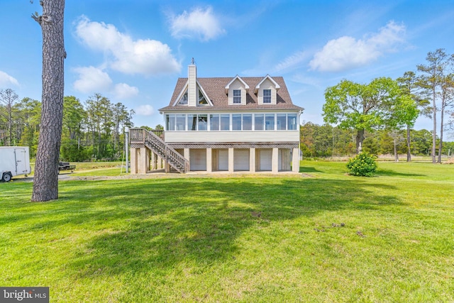 40461 Old Breton Beach Rd, Leonardtown, MD 20650 - rear view of property with a sunroom, stairs, a chimney, a deck, and a yard