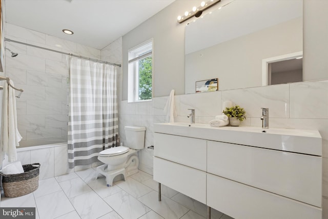1002 S Colorado St, Philadelphia, PA 19146 - bathroom with tile walls, double vanity, marble finish floors, and shower / bath combination with curtain