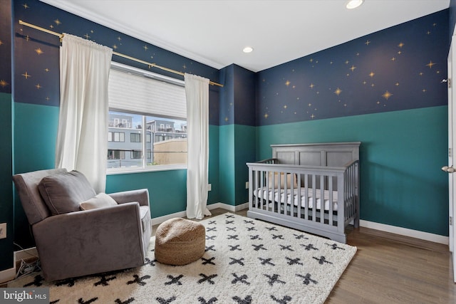 1002 S Colorado St, Philadelphia, PA 19146 - bedroom featuring wood finished floors, a nursery area, and recessed lighting