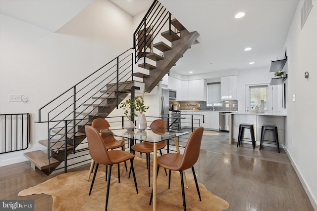 1002 S Colorado St, Philadelphia, PA 19146 - dining room with stairs, wood finished floors, and recessed lighting