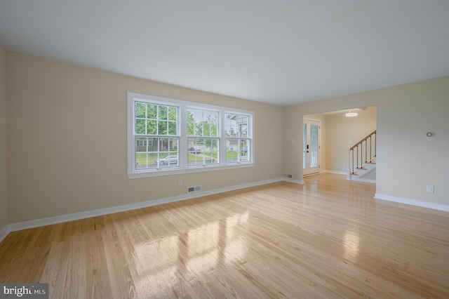 27 Kevin Way, Marlton, NJ 08053 - empty room featuring light wood-style flooring and stairway