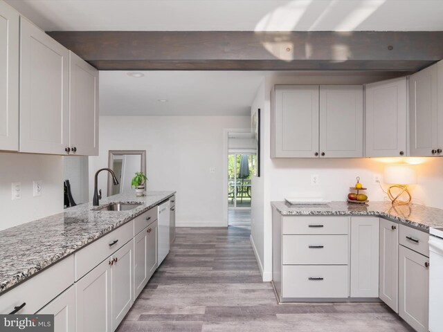 7802 Gary Ln, Severn, MD 21144 - kitchen with dishwasher, light wood-style flooring, light stone counters, white cabinets, and recessed lighting
