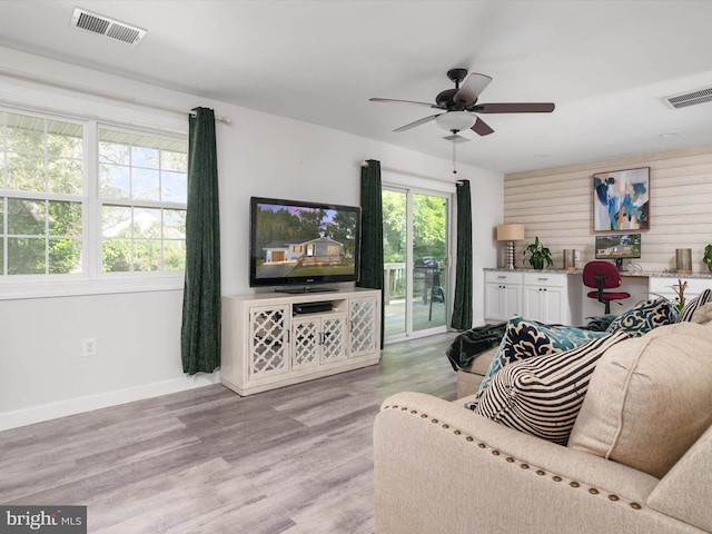 7802 Gary Ln, Severn, MD 21144 - living area with light wood-type flooring and ceiling fan