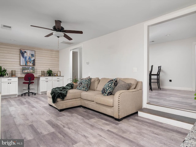7802 Gary Ln, Severn, MD 21144 - living room with ceiling fan, light wood-style flooring, and built in desk
