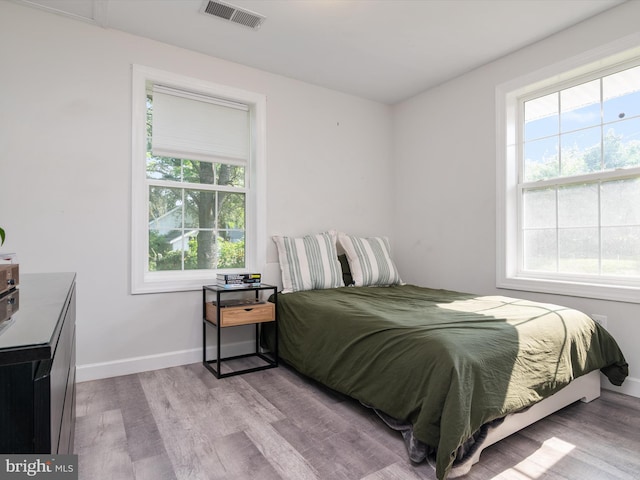 7802 Gary Ln, Severn, MD 21144 - bedroom featuring wood finished floors and multiple windows