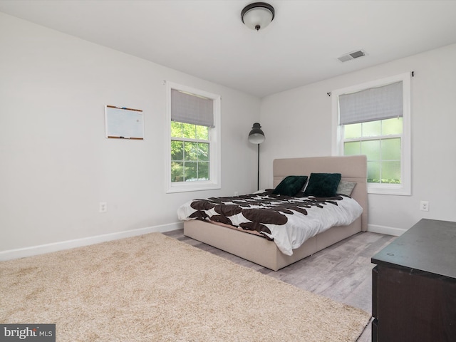 7802 Gary Ln, Severn, MD 21144 - bedroom featuring baseboards and light wood finished floors