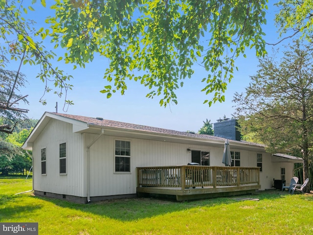 7802 Gary Ln, Severn, MD 21144 - back of property featuring a deck, crawl space, a lawn, and a chimney