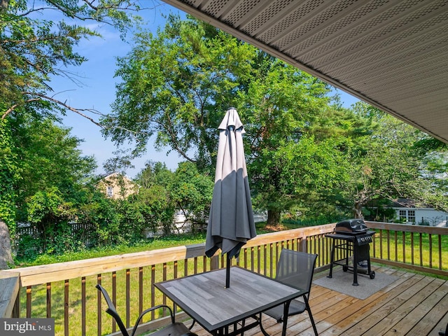 7802 Gary Ln, Severn, MD 21144 - deck with a yard, outdoor dining space, grilling area, and view of wooded area