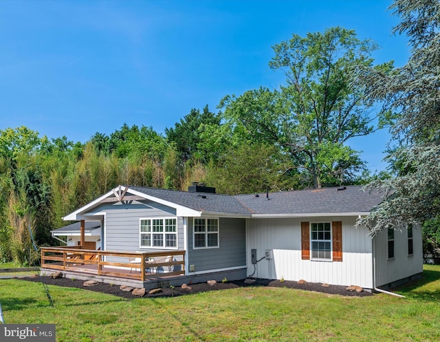 7802 Gary Ln, Severn, MD 21144 - rear view of house featuring a deck and a yard