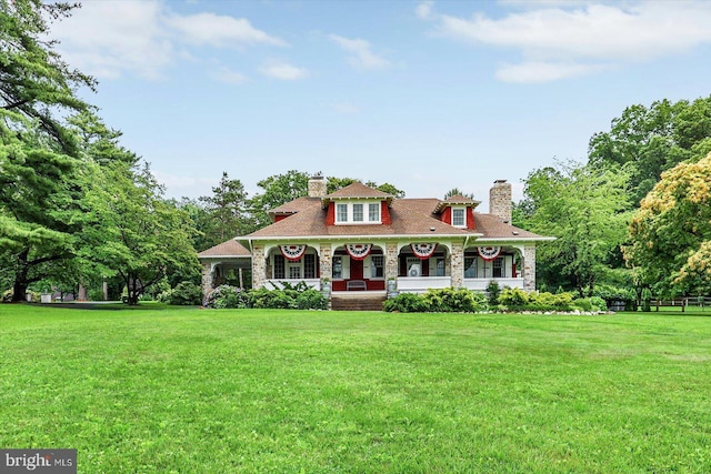 2165 Broadway, Hanover, PA 17331 - view of front of home featuring covered porch, a front lawn, a chimney, and stone siding