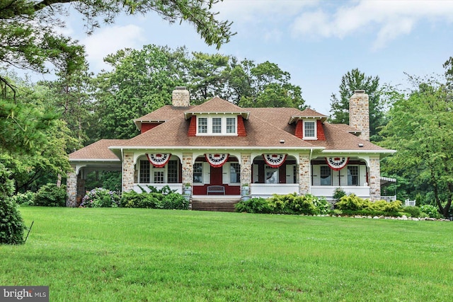 2165 Broadway, Hanover, PA 17331 - view of front of property with a chimney, a porch, and a front lawn