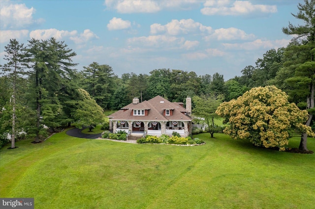 2165 Broadway, Hanover, PA 17331 - view of front of property with covered porch, a chimney, a front yard, and a view of trees