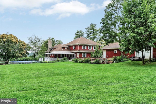 2165 Broadway, Hanover, PA 17331 - back of house with a lawn and a chimney