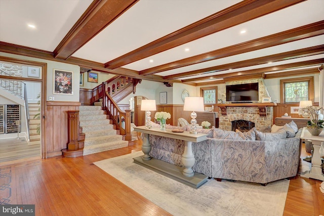2165 Broadway, Hanover, PA 17331 - living room featuring stairway, a brick fireplace, wainscoting, plenty of natural light, and beam ceiling