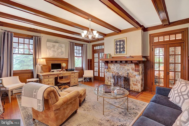 2165 Broadway, Hanover, PA 17331 - living area with a stone fireplace, french doors, a desk, wood finished floors, and a chandelier