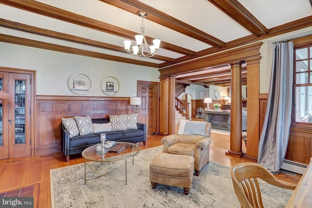 2165 Broadway, Hanover, PA 17331 - living room with ornate columns, a chandelier, wood finished floors, stairs, and beam ceiling