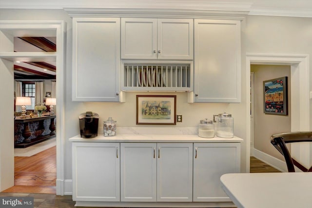 2165 Broadway, Hanover, PA 17331 - kitchen featuring ornamental molding, light countertops, wood finished floors, and beamed ceiling