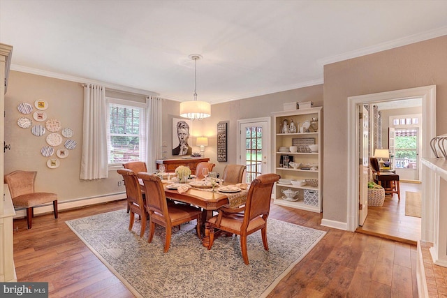 2165 Broadway, Hanover, PA 17331 - dining area with light wood-type flooring, a baseboard radiator, and ornamental molding