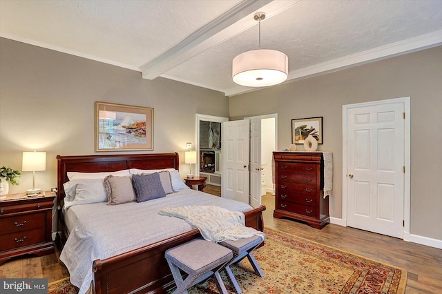 2165 Broadway, Hanover, PA 17331 - bedroom with beamed ceiling, wood finished floors, ensuite bath, and crown molding