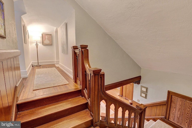 2165 Broadway, Hanover, PA 17331 - stairway with a textured ceiling, vaulted ceiling, and wood finished floors