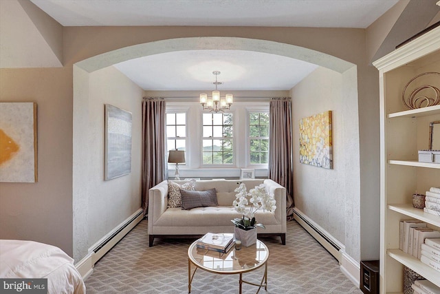 2165 Broadway, Hanover, PA 17331 - living area with baseboard heating, a chandelier, and arched walkways
