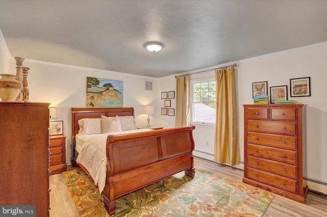 2165 Broadway, Hanover, PA 17331 - bedroom featuring light wood-style flooring, crown molding, and a baseboard heating unit