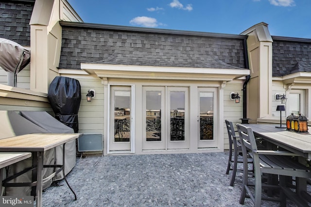 508 Rampart Way Unit 6, Oxon Hill, MD 20745 - rear view of property featuring a shingled roof, mansard roof, a patio area, and outdoor dining space