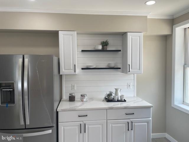924 N Belnord Ave, Baltimore, MD 21205 - kitchen with stainless steel fridge, crown molding, white cabinets, baseboards, and open shelves