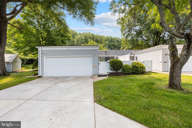 14627 Deerhurst Ter Unit 214-A, Silver Spring, MD 20906 - view of front of home featuring a gate, an attached garage, and driveway