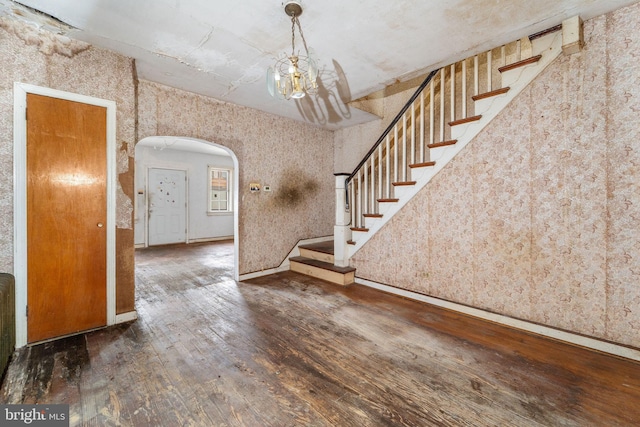 977 N 23rd St, Camden, NJ 08105 - foyer with arched walkways, hardwood / wood-style floors, stairs, and wallpapered walls