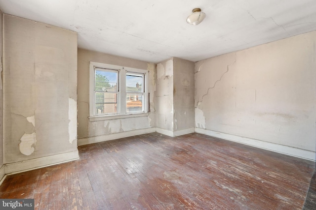 977 N 23rd St, Camden, NJ 08105 - empty room featuring hardwood / wood-style floors and baseboards