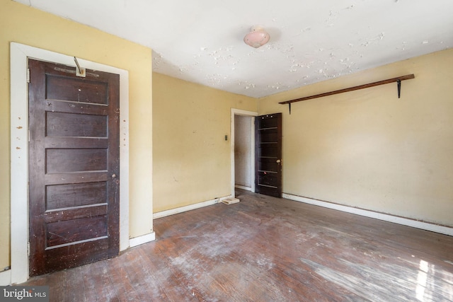 977 N 23rd St, Camden, NJ 08105 - spare room with wood finished floors and baseboards